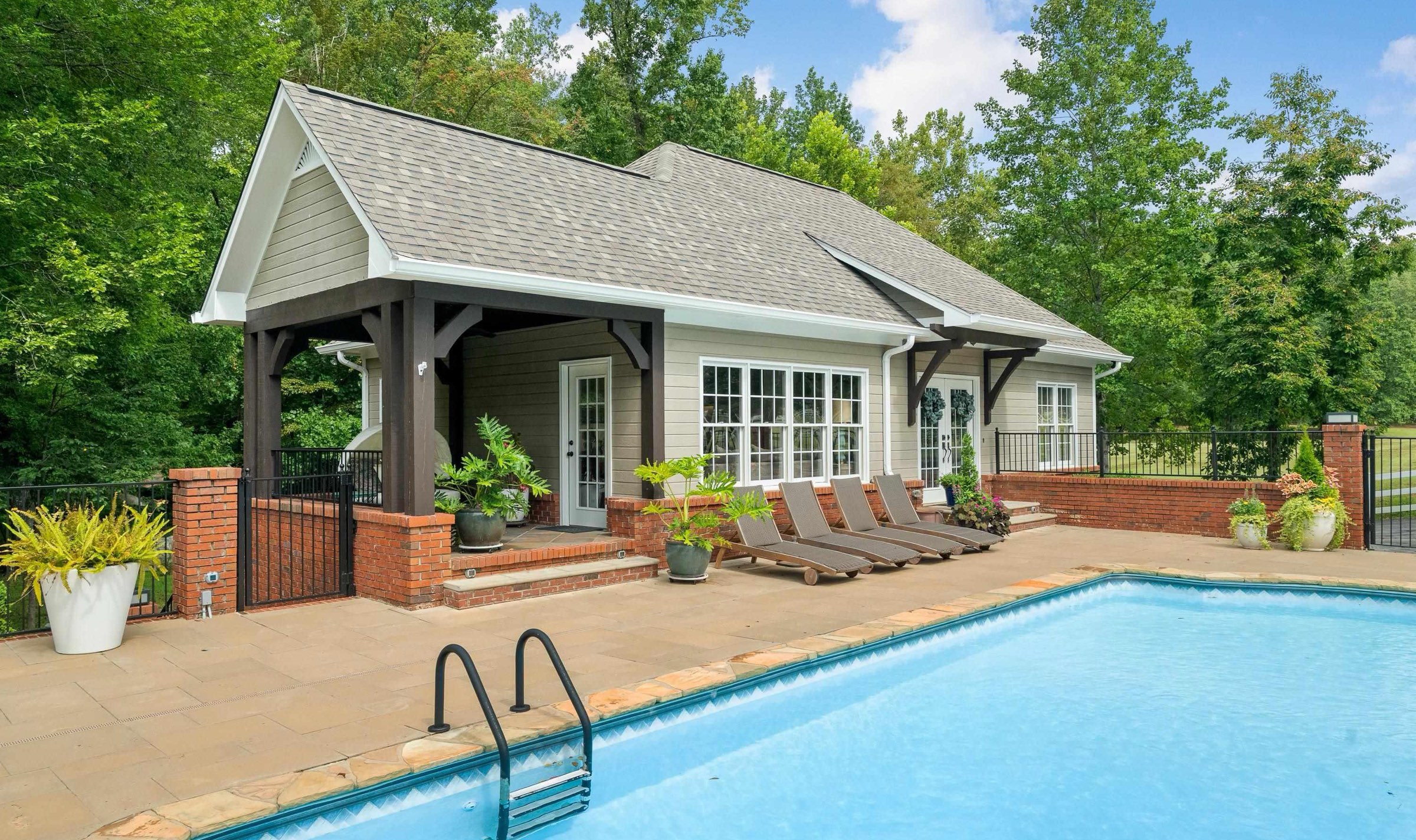 The carriage house beside the pool